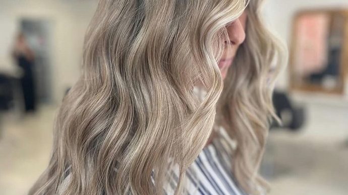 Beige blonde waves, coloured and styled in the salon.